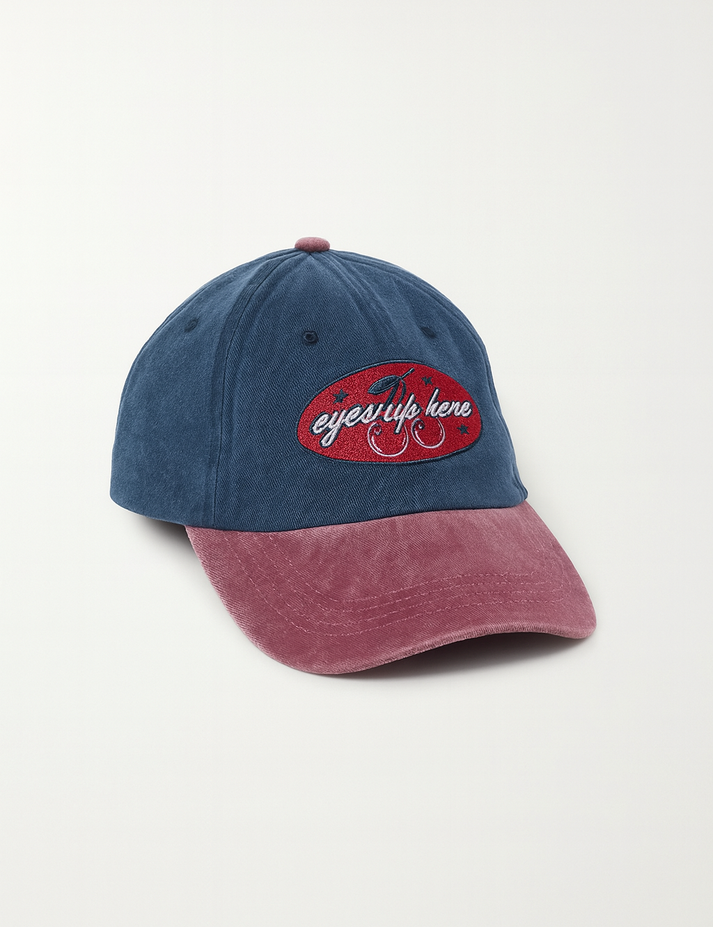 Eyes_Up_Here_Cap_Blue_Red_Flatlay.png
